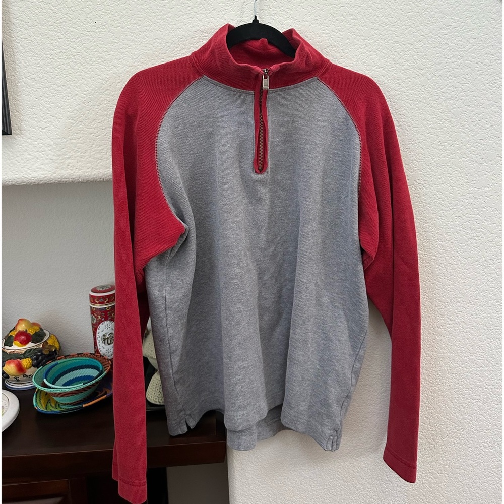red and gray half zip jacket